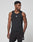 A man models the LIVE FAST DIE YOUNG Live Fast Performance Tank, a slim fit black sleeveless athletic top, with matching shorts, standing against a plain white background and looking to the side.