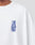A person wears the Live Fast Lenox Tee by LIVE FAST DIE YOUNG, an oversized white cotton shirt with bold blue LIVE FAST on the chest, Jim Jones ©2023 below, and stylish front and back prints for extra impact.