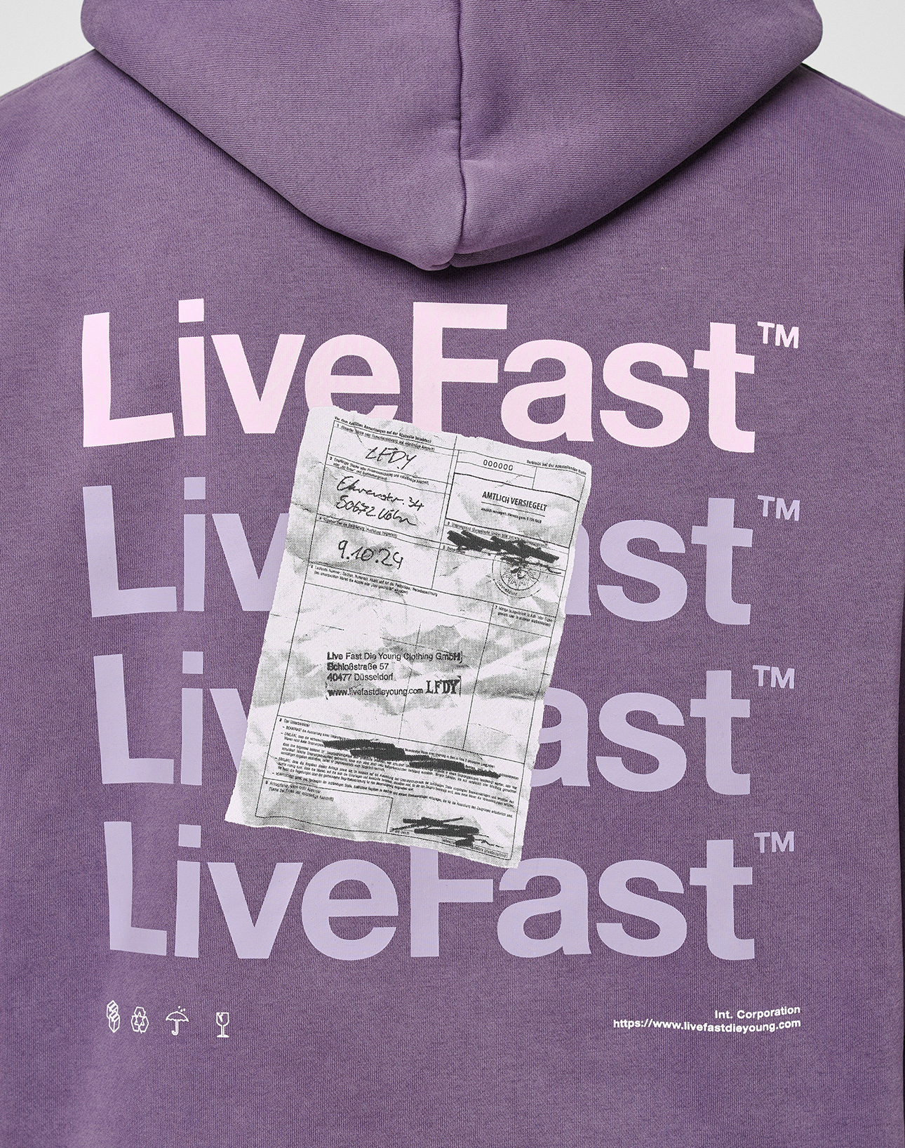 The Basic Evidence Hooded by LIVE FAST DIE YOUNG is a purple oversized cotton-poly hoodie with front and back print: white and pink “LiveFast™” text over a receipt-style graphic, plus small symbols and text at the bottom.