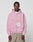 A man faces the camera in a neutral pose, wearing the LIVE FAST DIE YOUNG LFDY Vandals Hooded Zip in light pink with a “Vandals Metro” front print, paired with beige pants, against a plain background.