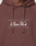 Close-up of a person wearing the LFDY Embroidery Hooded by LIVE FAST DIE YOUNG, a brown hoodie with "PARIS Live Fast DIE YOUNG" embroidery on the chest, drawstrings, Raglan sleeves, and made from soft French Terry.