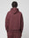 A person with short, twisted hair is shown from behind wearing a maroon LIVE FAST DIE YOUNG LFDY Embroidery Hooded and sweatpants set made from soft French Terry, against a plain light background.