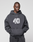 A young man wears the LFDY 40 Hoodie by LIVE FAST DIE YOUNG, an oversized hoodie with drawstrings, a white graphic, and a Kangaroo-Tasche, standing against a plain light gray background with hands in the front pocket.