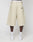 A person is seen from behind wearing beige LFDY Twill Shorts by LIVE FAST DIE YOUNG, featuring an oversize fit, two back pockets, a small patch, and 100% cotton. White socks, sneakers, and a visible white waistband complete the look.