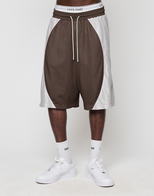 A person in LFDY League Shorts by LIVE FAST DIE YOUNG, white LIVE FAST waistband underwear, white socks, and white sneakers stands against a plain white background.