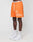 A person wearing LIVE FAST DIE YOUNG LFDY Praying Mesh Shorts in orange with white graphics, white socks, and Nike Air Force 1 sneakers stands against a plain white background. Only the lower half of the body is visible.