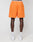 A person stands with their back to the camera in orange LFDY Praying Mesh Shorts by LIVE FAST DIE YOUNG, featuring a Regular Fit, elastic waistband, small back pocket, and visible underwear band. They wear white socks and sneakers against a plain white background.