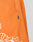 Close-up of orange LFDY Praying Mesh Shorts by LIVE FAST DIE YOUNG, showing perforated polyester fabric with an elastic waistband, small black LFDY tag, and part of a white graphic near the hem.