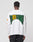 A person with short hair, seen from behind, wears the LIVE FAST DIE YOUNG No Rich Parents Longsleeve—a white French Terry Regular Fit shirt featuring bold green, yellow, and black NO RICH PARENTS text on the back and orange sleeve graphics.