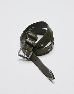 The LFDY Signature Belt by LIVE FAST DIE YOUNG, in olive green with a shiny metal buckle and metal studs, is shown rolled up on a white surface.