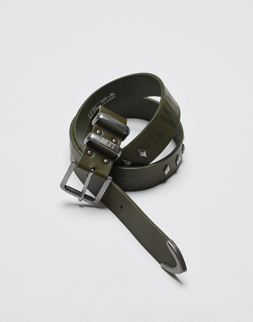 The LFDY Signature Belt by LIVE FAST DIE YOUNG, in olive green with a shiny metal buckle and metal studs, is shown rolled up on a white surface.