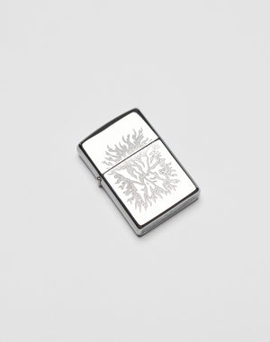 A silver rectangular LFDY x Zippo lighter by LIVE FAST DIE YOUNG features an engraved flame design on its aluminium case, displayed on a plain white background.| plain 