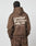 A person with braided hair is wearing an oversize fit brown LIVE FAST DIE YOUNG Basic 360 Hooded and matching pants. The back showcases bold white text, a small paragraph, and icons underneath.