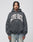 A man with braided hair models the LIVE FAST DIE YOUNG Live Fast Axe Hooded, a soft Baumwolle oversize-fit dark gray hoodie with bold white LIVE FAST lettering, paired with light blue jeans against a plain light background.