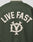 The Live Fast College Jacket by LIVE FAST DIE YOUNG has bold beige LIVE FAST lettering and a stylized emblem on the back, with striking contrast-color details for a standout dark green look.