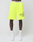 A person wears bright yellow LFDY Guaranteed Mesh Shorts by LIVE FAST DIE YOUNG with an elastic waistband, black text, white socks, and white sneakers, standing against a plain light background.