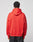 A person in the LIVE FAST DIE YOUNG Live Fast Fractured Hooded, an oversize fit red sweatshirt with doppellagige Kapuze made from a soft cotton-poly blend, and black pants stands facing away against a light gray background.