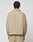Seen from behind against a plain white background, a person with short, twisted hair wears the beige LFDY Padded Shirt by LIVE FAST DIE YOUNG with matching pants.