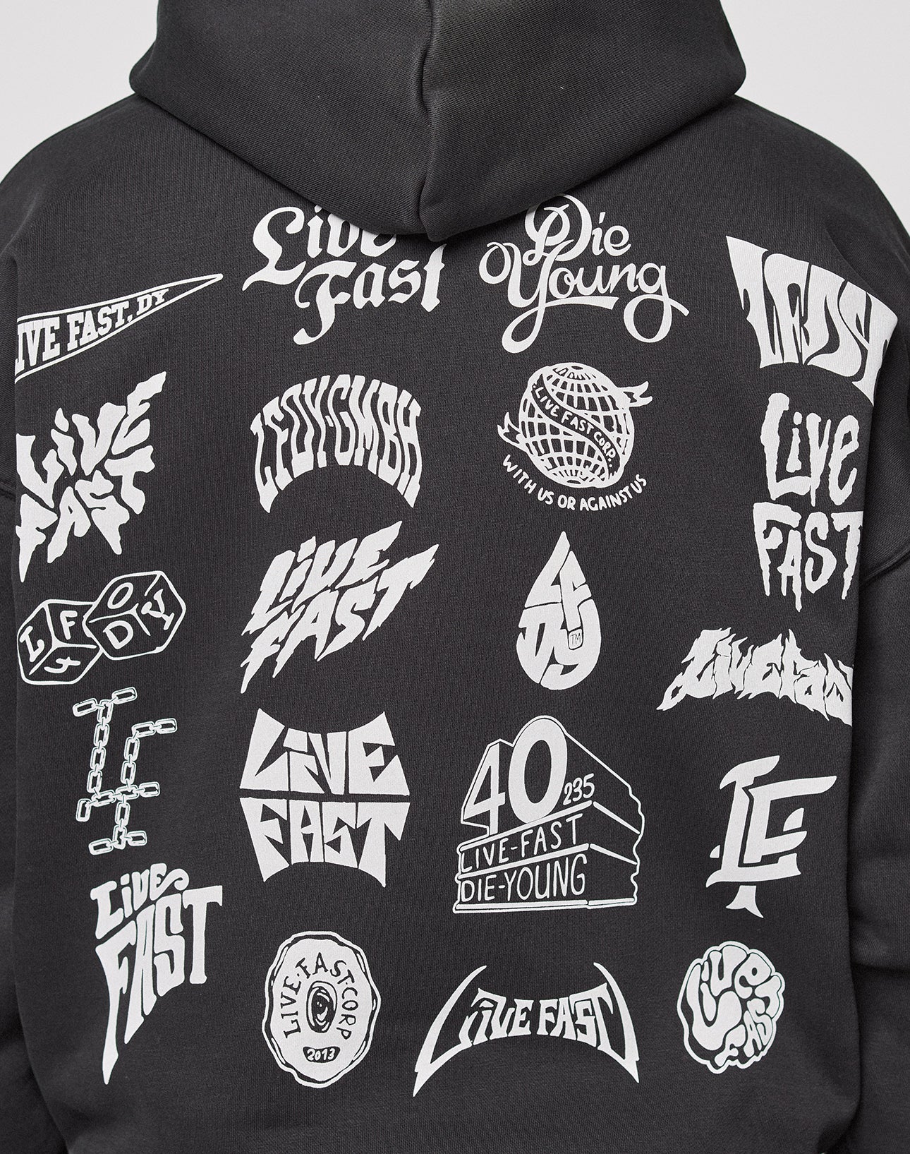 The LFDY Logo Hooded Zip by LIVE FAST DIE YOUNG is a black oversized Baumwolle hoodie with bold white multilogo graphics and edgy Live Fast Die Young phrases in stylized fonts across the back.
