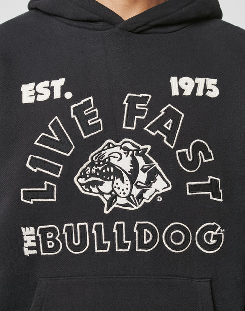 The LFDY The Bulldog Hooded by LIVE FAST DIE YOUNG is a black oversize fit hoodie with EST. 1975, LIVE FAST, THE BULLDOG, and a fierce embroidered bulldog head with spiked collar in white and black.