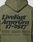 Back view of the LIVE FAST DIE YOUNG Basic 360 Hooded in olive green, oversize fit, bold black “LiveFast ArmyGrn 17-0517” text, smaller description below, topstitching, and icons with company info at the bottom.