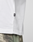 Close-up of a person wearing the LFDY Sphere Tee by LIVE FAST DIE YOUNG, styled with camouflage pants. Only the torso and upper legs are visible.