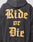 A person wearing the LIVE FAST DIE YOUNG Ride or Die Hooded—an oversized dark hoodie with a double-layer hood and bold yellow Gothic Ride or Die text on the back.
