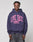 A person wearing the LIVE FAST DIE YOUNG Live Fast Stallion Hooded, an oversize navy cotton hoodie with a pink LIVE FAST horse graphic, stands against a plain light grey background.