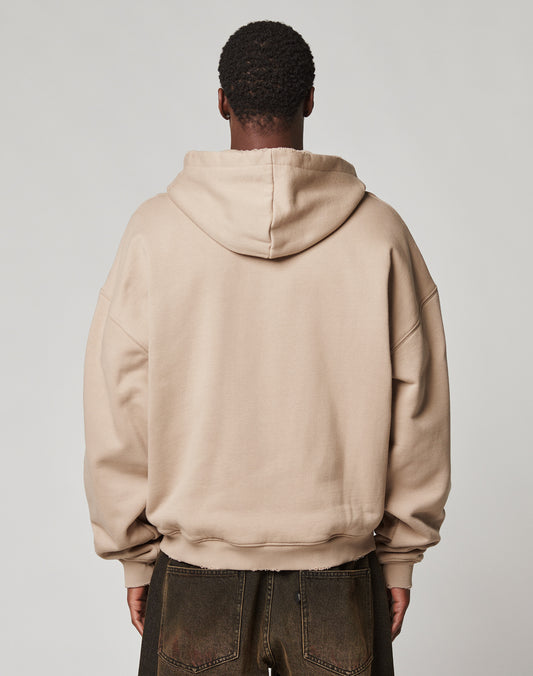A person faces away from the camera, wearing the LIVE FAST DIE YOUNG LFDY Double Hooded Zip with waffle Innenfutter and dark pants, standing against a plain light gray background.