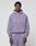 A person wears the LFDY Hotline Hooded by LIVE FAST DIE YOUNG—an oversized lavender hoodie with drawstring hood, matching pants, and white/pink "Approval GUARANTEED Credit Score Irrelevant" print—against a plain light background.