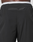 Close-up of the back of a person wearing LFDY Performance Pants by LIVE FAST DIE YOUNG, featuring a zippered pocket below the waistband, LFDY branding, and a visible white elastic waistband above.