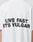 The Capri Tube Tee by LIVE FAST DIE YOUNG is a white cotton T-shirt with an Oversize Fit, featuring bold black LIVE FAST ITS VULGAR text on the back.