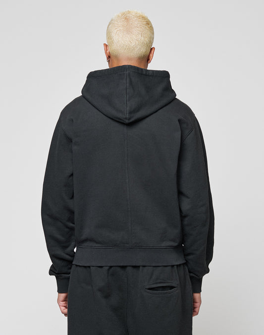A person with short, bleached blond hair is seen from behind in a LIVE FAST DIE YOUNG LFDY Lightweight Hooded Zip and matching black pants, hood down, against a plain gray background.