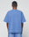 A person with short hair faces away, wearing an oversize fit LIVE FAST DIE YOUNG Basic +49 Tee in light blue with matching shorts made from weicher Baumwolle, set against a plain light gray background.