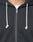 Close-up of a person wearing the LIVE FAST DIE YOUNG LFDY Lightweight Hooded Zip. Features include white knotted drawstrings, a partially zipped front revealing a white shirt, and 100% Baumwolle fabric for comfort.