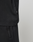 Close-up of the lower half of a black Oversize Fit Basic Evidence Tee by LIVE FAST DIE YOUNG, made from 100% Baumwolle, with a small side tag, paired with matching black pants featuring a visible pocket against a light background.