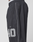 A close-up side view of a person wearing LIVE FAST DIE YOUNG LFDY Performance Trackpants in black with a white vertical stripe, side pocket, oversized fit, and large reflective "40" print on the thigh.