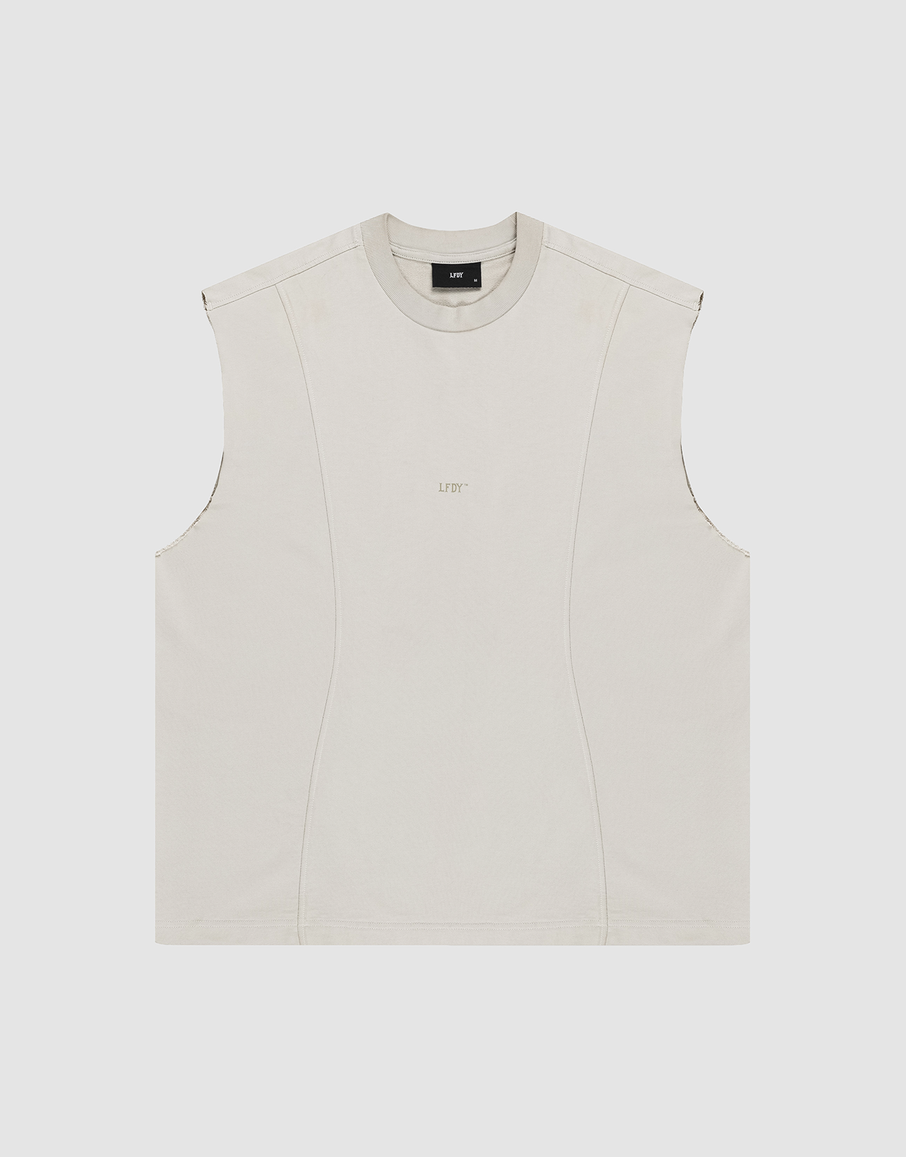 The LIVE FAST DIE YOUNG Heavy Muscle Tank is a sleeveless, light beige 100% cotton top with subtle seams, a crew neckline, and “LIFTY” text printed on the chest. Oversized fit shown laid flat on a plain white background.