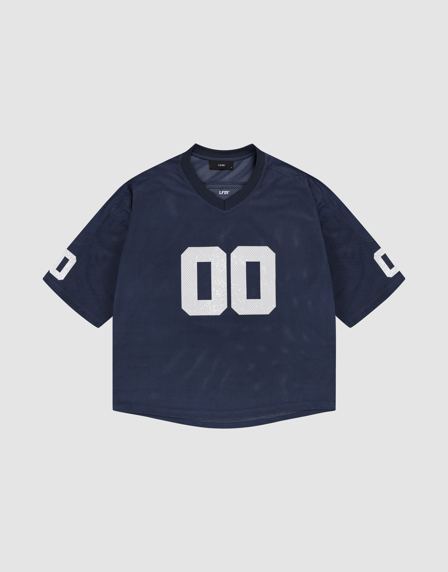 The LFDY Mesh Jersey by LIVE FAST DIE YOUNG is a navy blue oversize sports top with short sleeves, a white 00 on the front and sleeves, and a V-neck, shown against a plain light grey background.