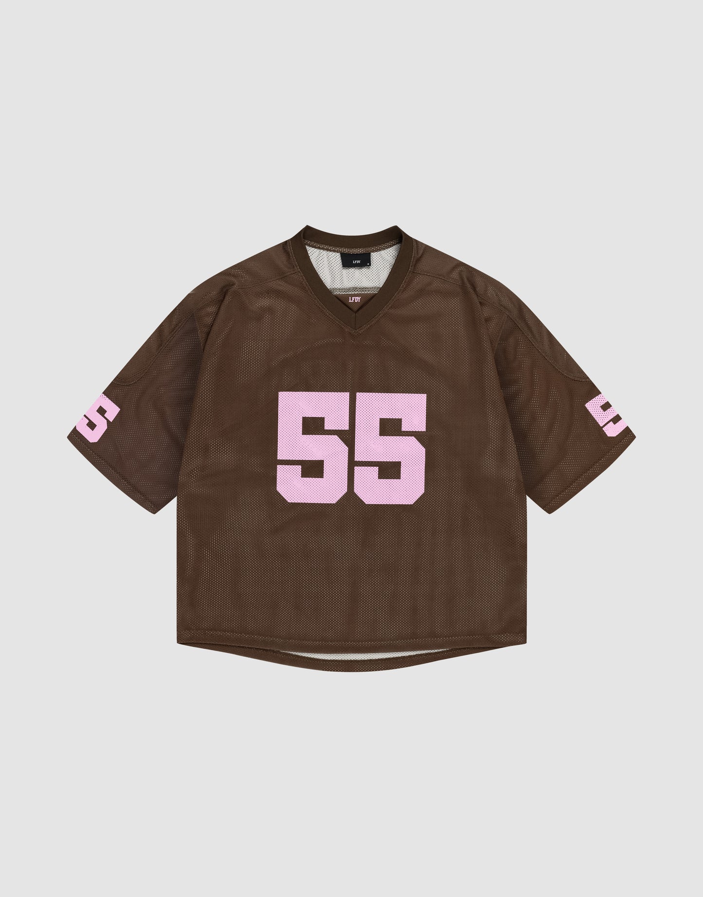 The LFDY Mesh Jersey by LIVE FAST DIE YOUNG is a brown polyester sports top with an oversized fit, showcasing the number 55 in bold pink print on the front and sleeves, shown against a plain white background.
