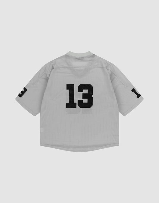 The LFDY Mesh Jersey by LIVE FAST DIE YOUNG is a light gray, short-sleeve polyester sports top with a V-neck and bold black number 13 printed on the back and both sleeves, shown against a plain white background.