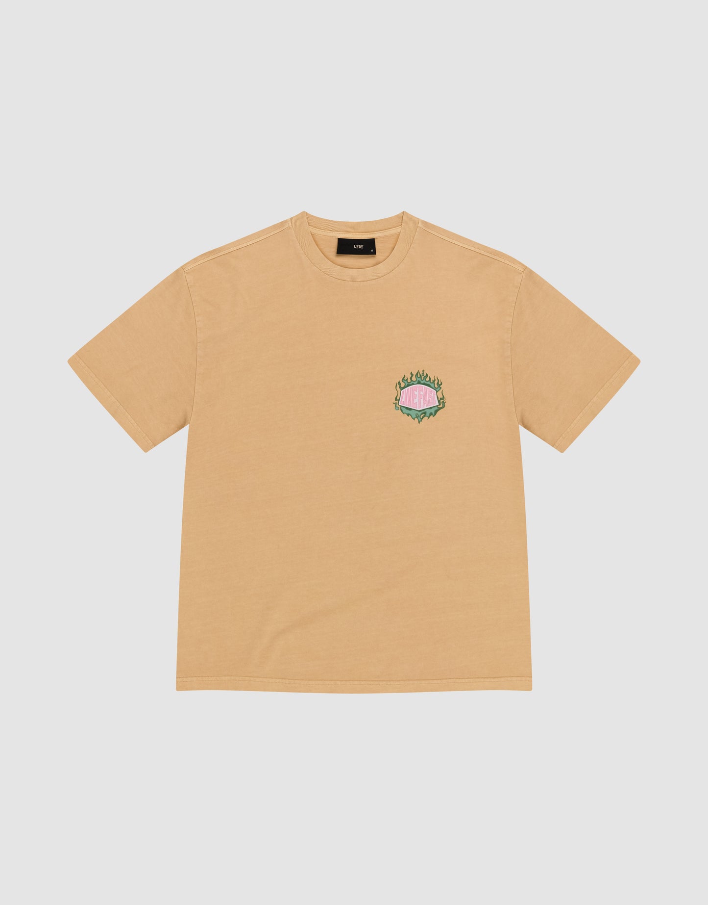 The LFDY Flames Chest Tee by LIVE FAST DIE YOUNG is a regular-fit tan t-shirt made of 100% cotton, featuring a small, colorful front print with a pink shape and green text on the left chest.
