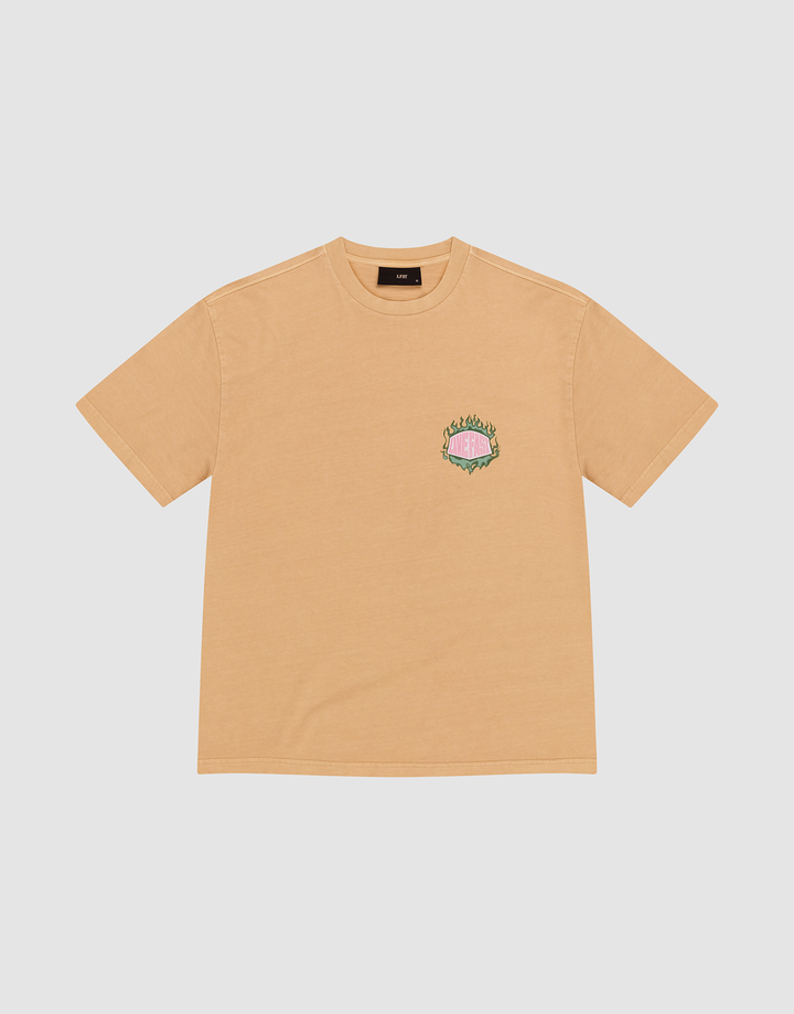 The LFDY Flames Chest Tee by LIVE FAST DIE YOUNG is a tan regular fit short-sleeve shirt, crafted from 100% Baumwolle, with a small colorful flames graphic and text on the left chest, shown against a white background. | plain