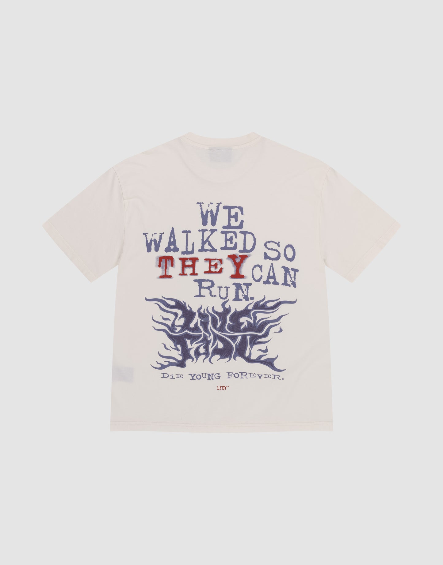 The LFDY We Walked Tee by LIVE FAST DIE YOUNG is a white, 100% Baumwolle oversized shirt with front and back prints: bold “WE WALKED SO THEY CAN RUN” (THEY in red), blue flames, and “DADS YOUNG FOREVER” for a relaxed vibe.