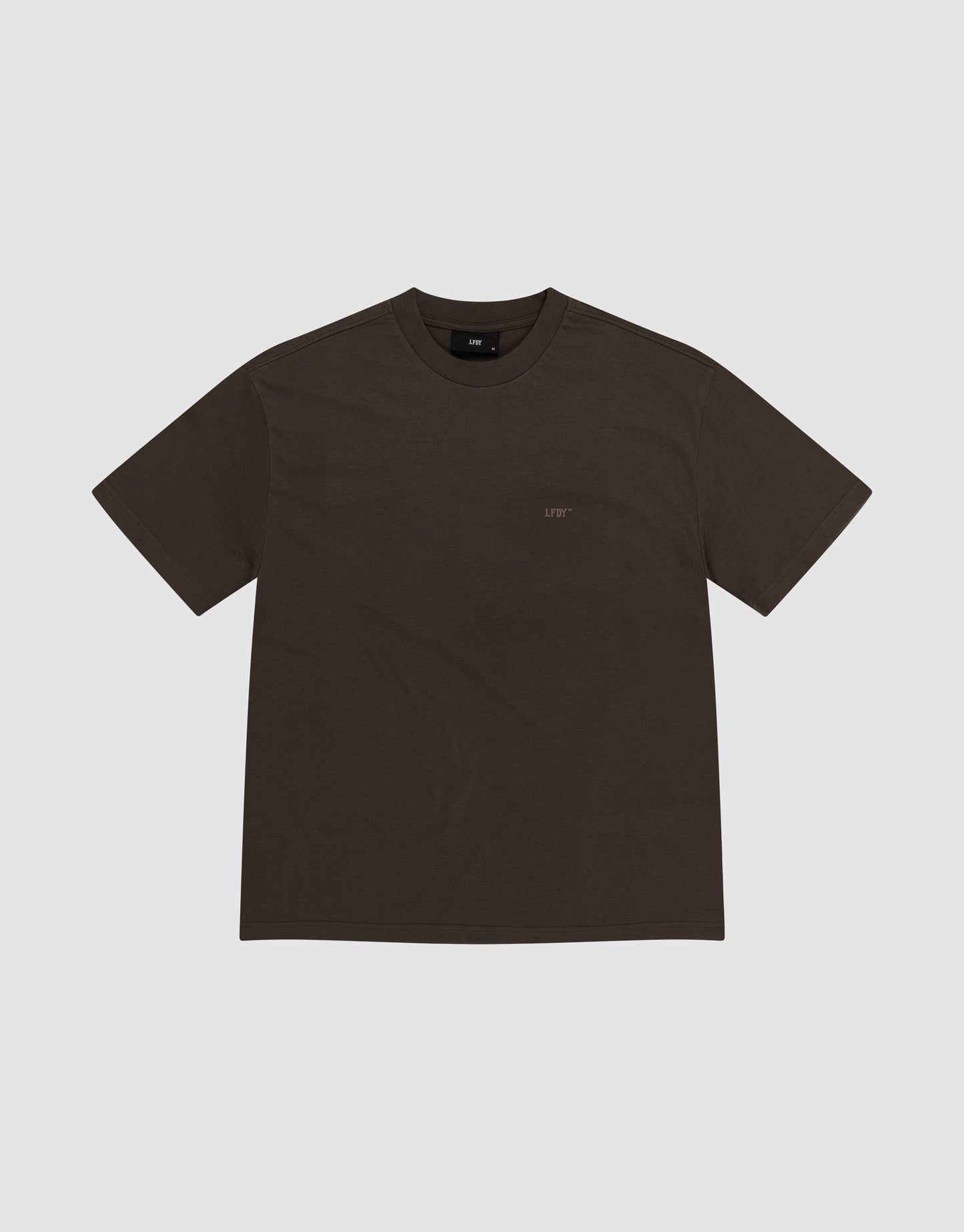 A plain dark brown short-sleeve LFDY Flash Tee by LIVE FAST DIE YOUNG, featuring a crew neck and crafted from soft cotton-slub fabric, is shown on a light gray background.