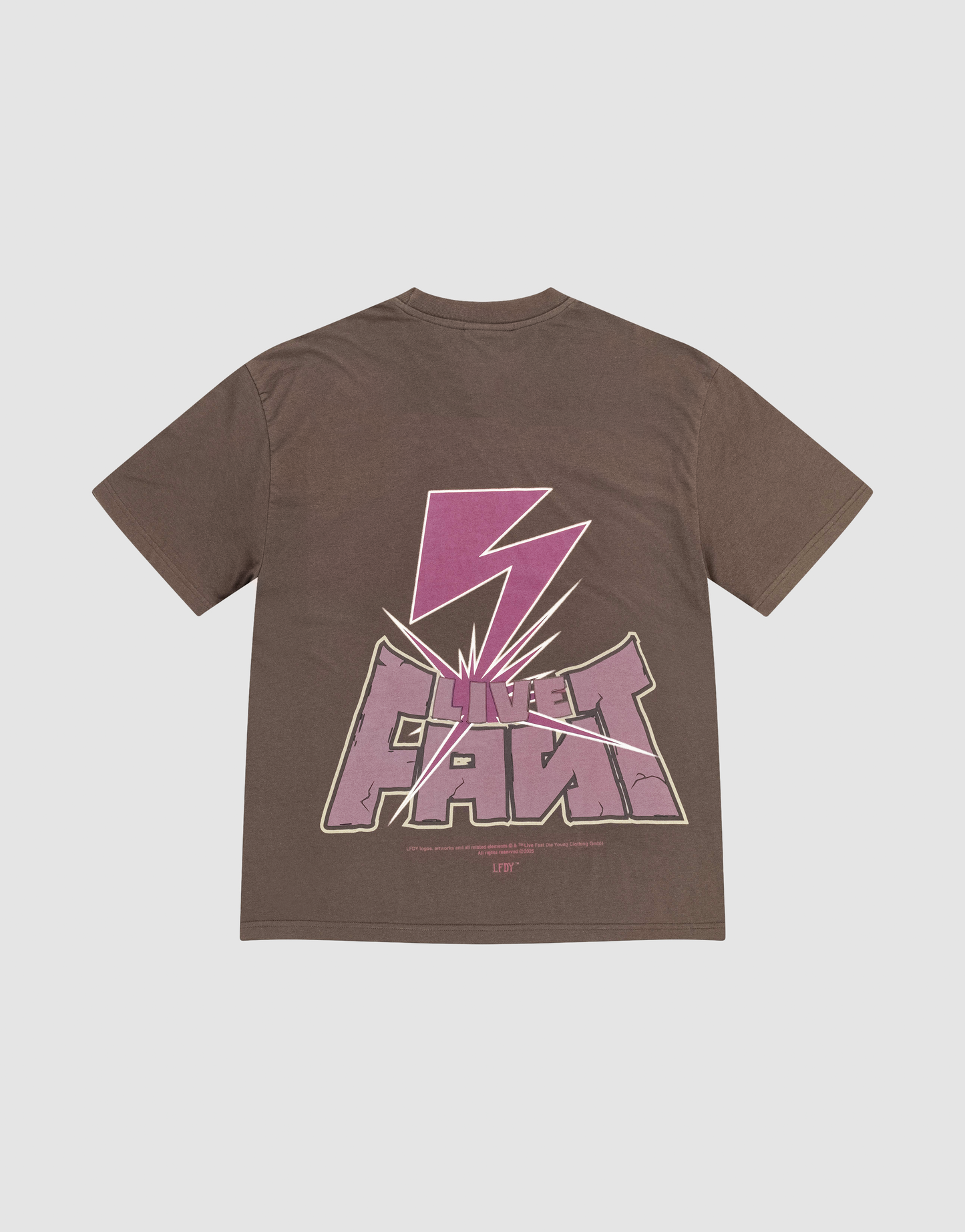 The LFDY Flash Tee by LIVE FAST DIE YOUNG is an oversize brown cotton tee featuring a bold pink lightning bolt and stylized LIVE FAST text in a modern graphic print on front and back. | plain