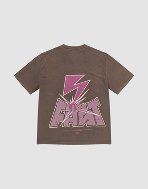 The LFDY Flash Tee by LIVE FAST DIE YOUNG is an oversize brown cotton tee featuring a bold pink lightning bolt and stylized LIVE FAST text in a modern graphic print on front and back. | plain