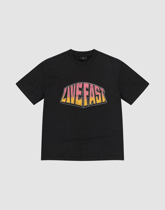 The LFDY Emblem Tee by LIVE FAST DIE YOUNG is a black oversize t-shirt with "LIVE FAST" in bold pink, orange, and yellow gradient print on the chest. Made from 100% Baumwolle and shown flat on a plain light gray background. | plain