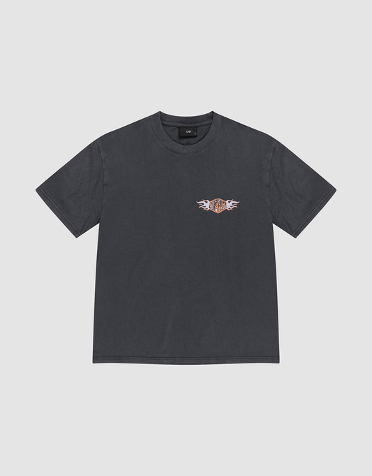 The LFDY Fire Chest Tee by LIVE FAST DIE YOUNG is a regular-fit black T-shirt with a small flaming orange and white logo graphic on the left chest. Made from 100% Baumwolle, it’s shown flat on a light gray background. | plain