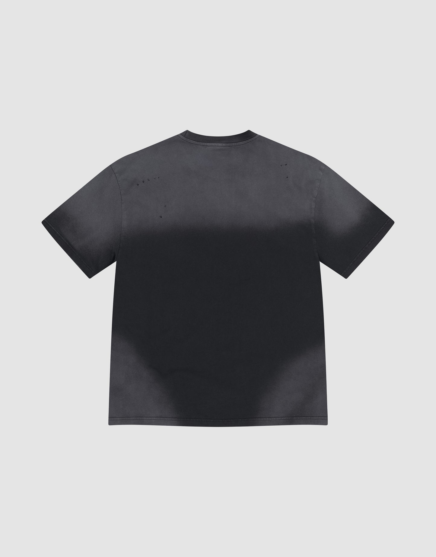 The LFDY Scribble Tee by LIVE FAST DIE YOUNG is an oversized, short-sleeve black shirt made from 100% Baumwolle with a handcrafted spray effect for a faded, bleached look along the lower half. Shown flat on a plain light gray background.